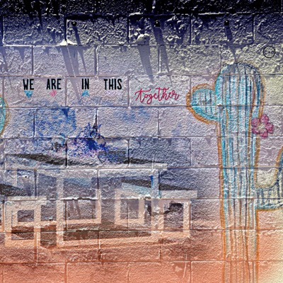 Mural on brick, with southwest images and text: "We are in this together."